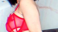 Busty babe playing with her big boobs