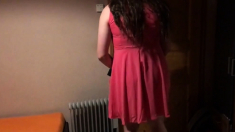Sissy in pink dress strokes her cock with cumshot on face